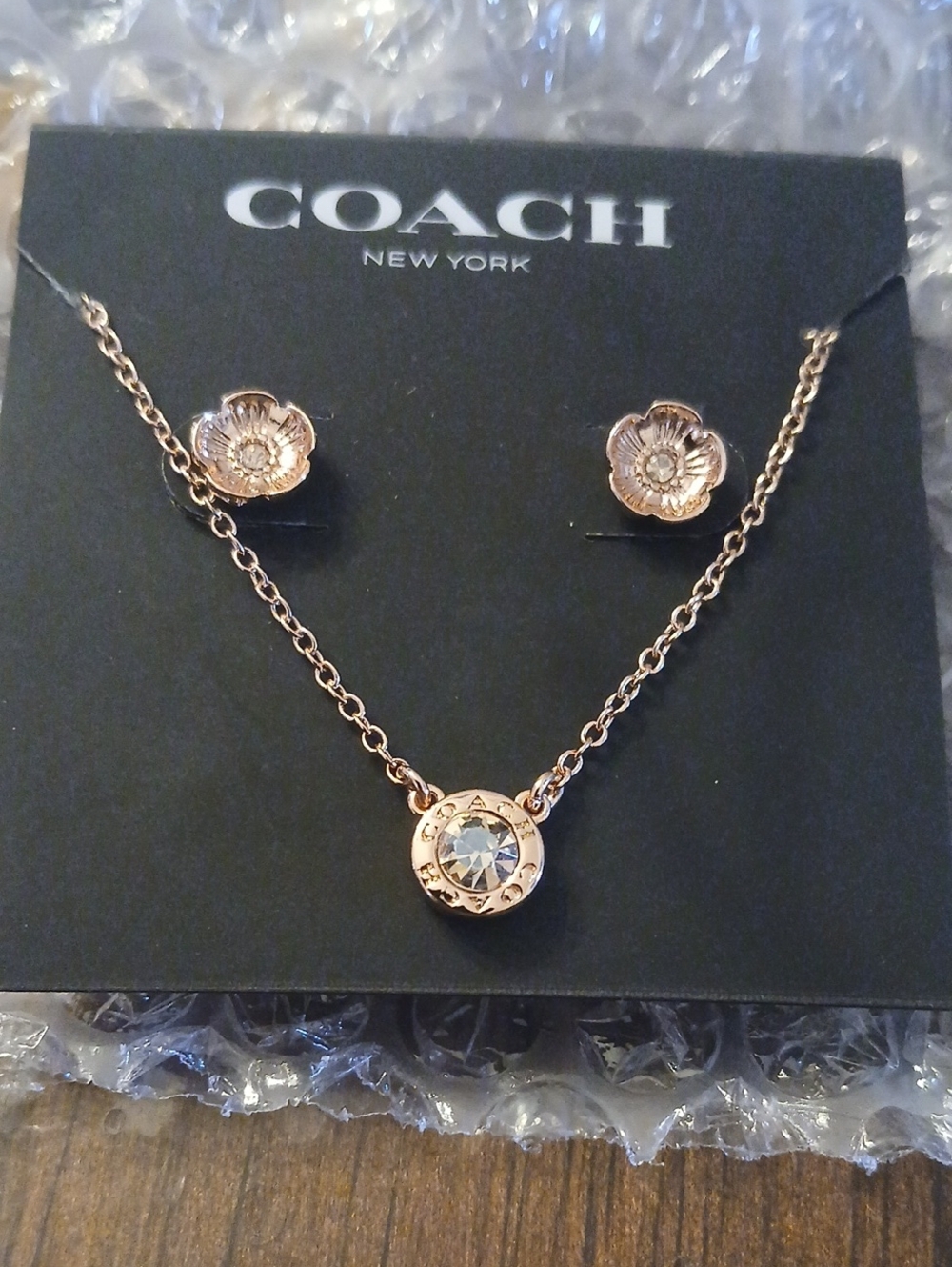COACH Rose Gold Tone Crystal Pendant Necklace with Floral Studs